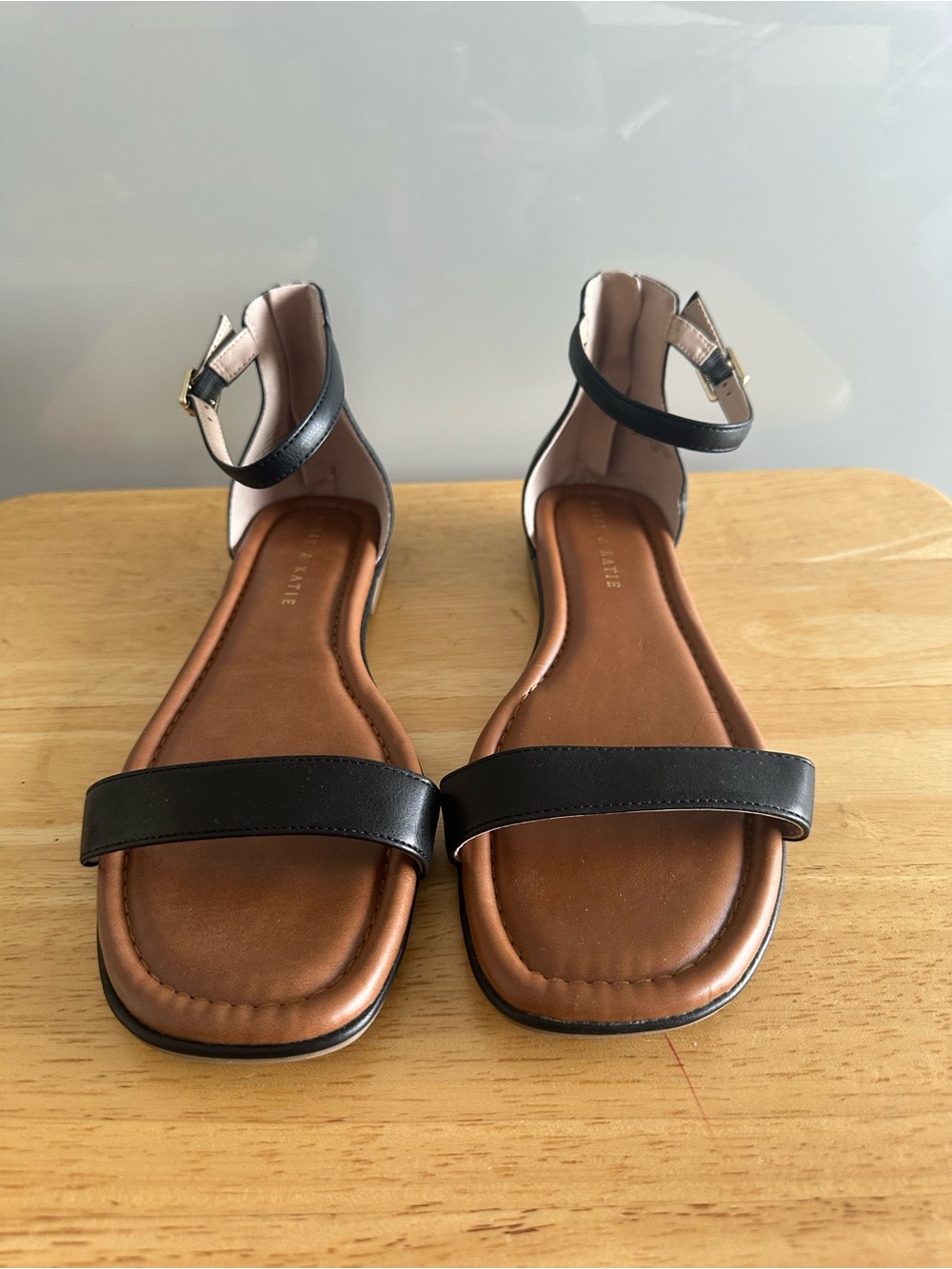 Kelly & Katie Black Ankle-Strap Flat Sandals with Brown Footbed